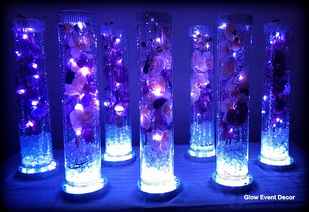 cylinder vase with purple orchids wedding table centrepieces, with submersible LED lighting and LED light base